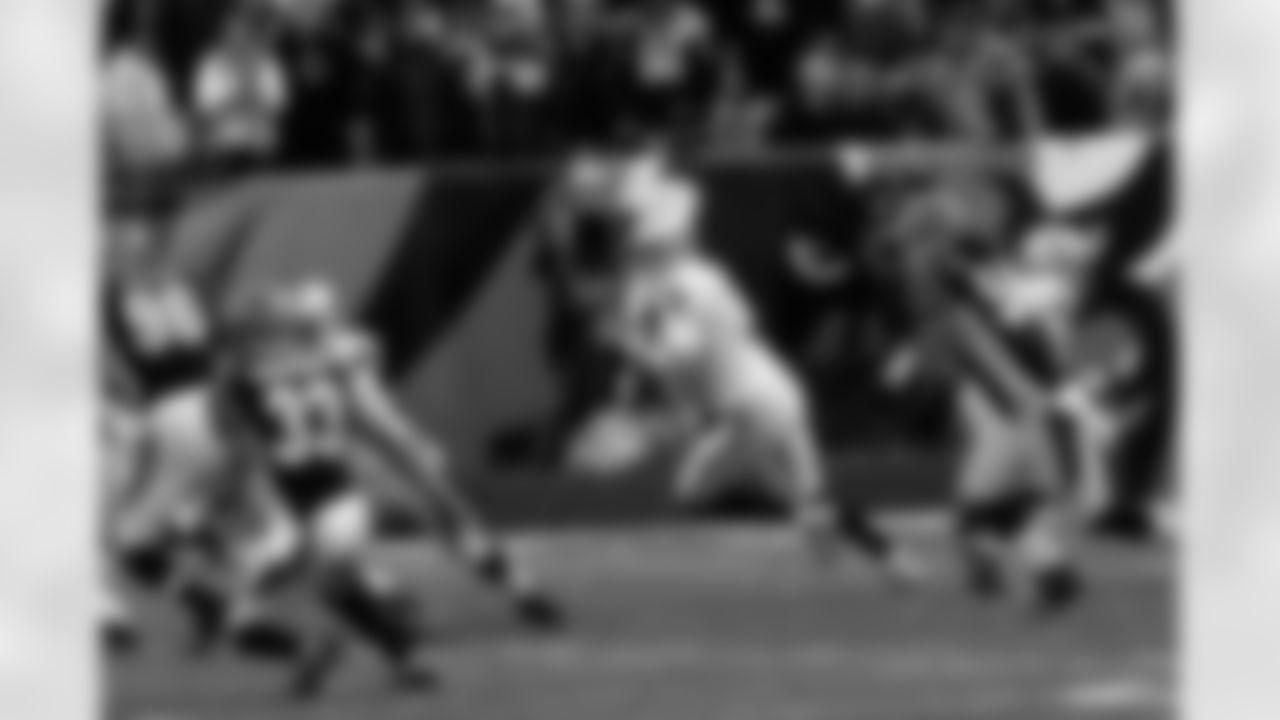 QB Carson Palmer rolls out to find an open receiver.