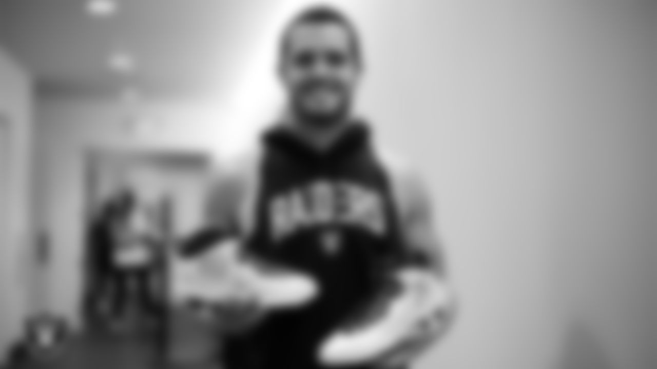 Las Vegas Raiders quarterback Derek Carr (4) unboxes his custom cleats for the NFL's My Cause My Cleats campaign at Intermountain Healthcare Performance Center.