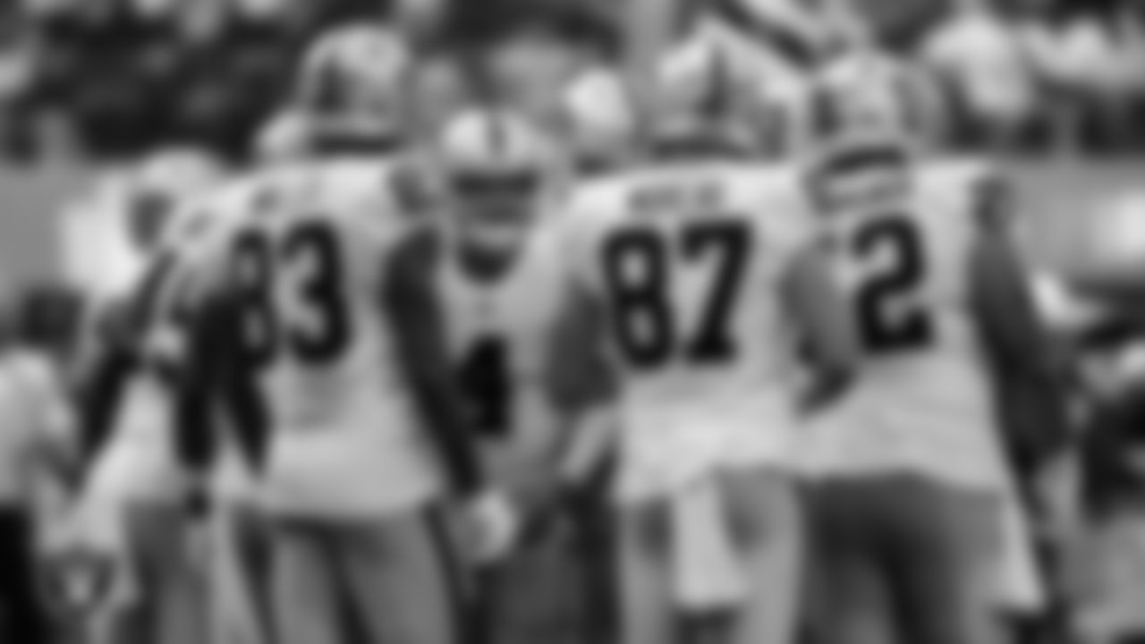 The Las Vegas Raiders huddle during the regular season away game against the Los Angeles Chargers at SoFi Stadium.