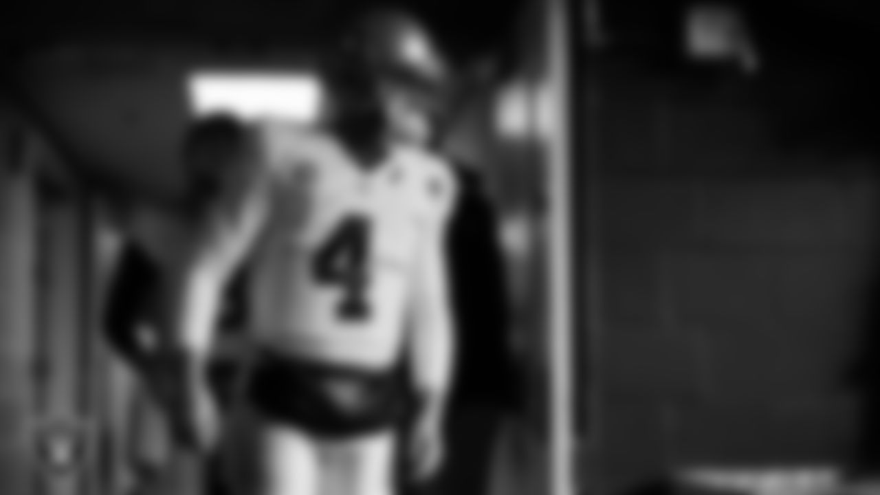Las Vegas Raiders quarterback Derek Carr (4) walks down the tunnel before the regular season away game against the Seattle Seahawks at Lumen Field.