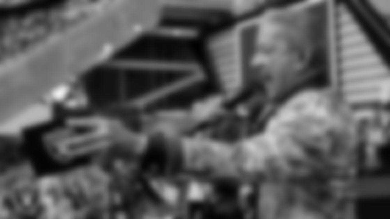 UFC octagon announcer Bruce Buffer pumps up the crowd before the regular season home game against the Miami Dolphins.