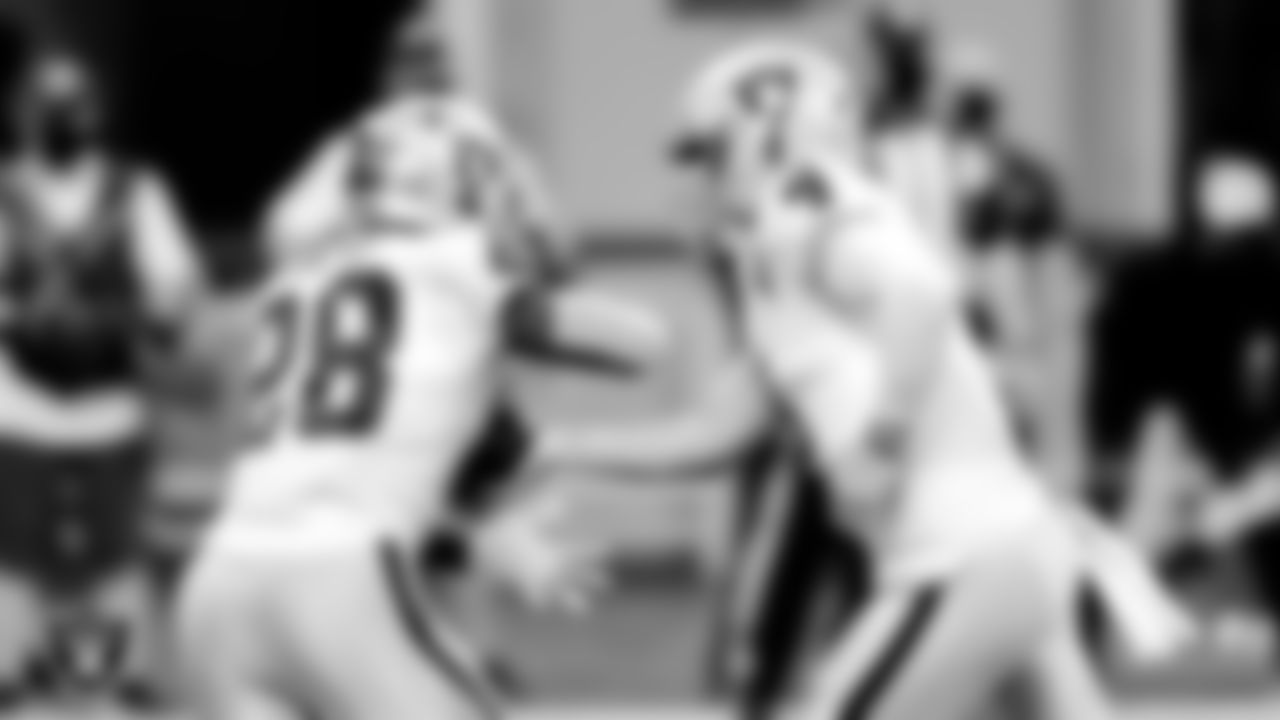 Las Vegas Raiders running back Josh Jacobs (28) and quarterback Derek Carr (4) during the regular season game against the Atlanta Falcons at Mercedes-Benz Stadium.