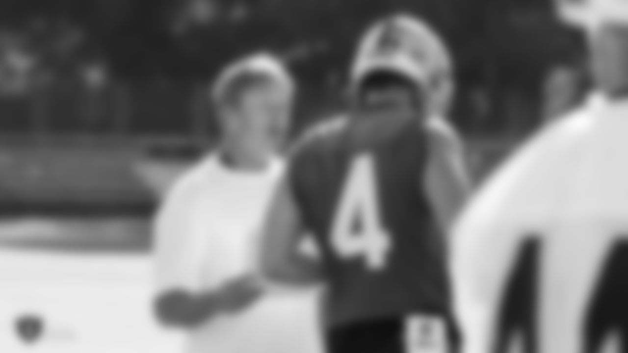 Oakland Raiders head coach Jon Gruden and quarterback Derek Carr (4) on the field for practice at 2018 Pre-Training Camp at The Oakland Raiders Napa Valley Training Complex, Wednesday, July 25, 2018, in Napa, California.
