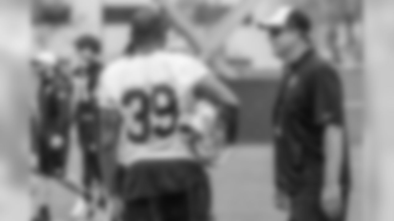 Head Coach Jack Del Rio and CB Keith McGill