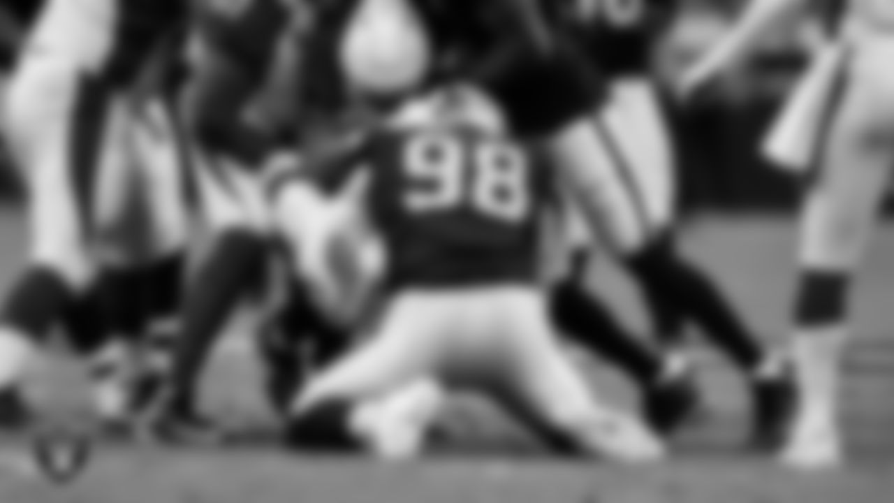 Las Vegas Raiders defensive end Maxx Crosby (98) sacks the quarterback during the regular season home game against the Arizona Cardinals at Allegiant Stadium.