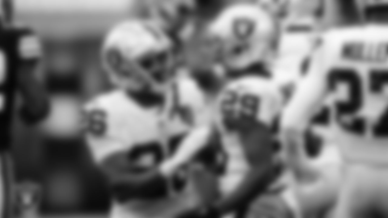 Las Vegas Raiders cornerback Nevin Lawson (26) and safety Lamarcus Joyner (29) celebrate during the regular season away game against the Cleveland Browns.
