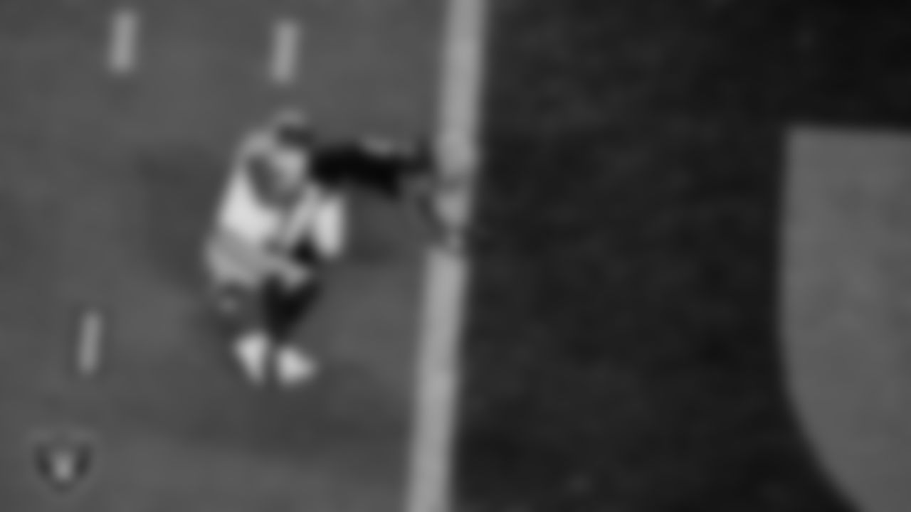 Las Vegas Raiders wide receiver Jakobi Meyers (16) dives into the end zone after making a 9-yard touchdown catch during the regular season home game against the Green Bay Packers at Allegiant Stadium.