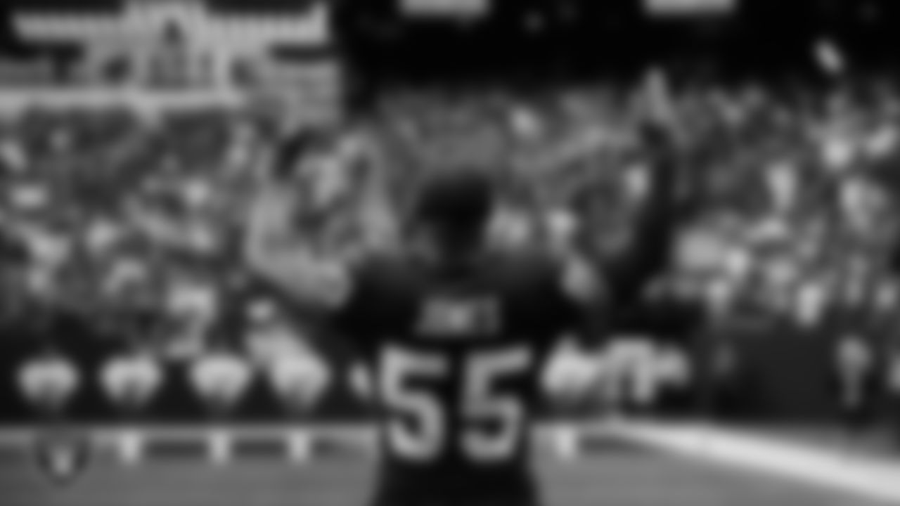 Las Vegas Raiders defensive end Chandler Jones (55) pumps up the crowd before the regular season home game against the Arizona Cardinals at Allegiant Stadium.