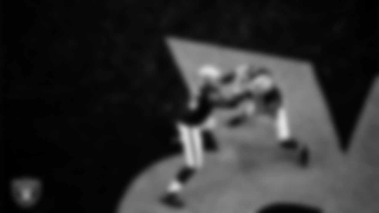 Las Vegas Raiders tackle Brandon Parker (75) and defensive end Carl Nassib (94) warming up before the regular season home game against the New Orleans Saints.