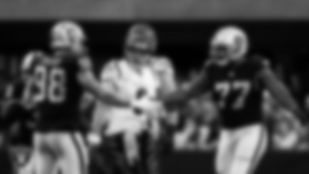 Las Vegas Raiders defensive tackle Quinton Jefferson (77) celebrates with defensive end Maxx Crosby (98) after sacking the quarterback during the regular season home game against the Cincinnati Bengals.