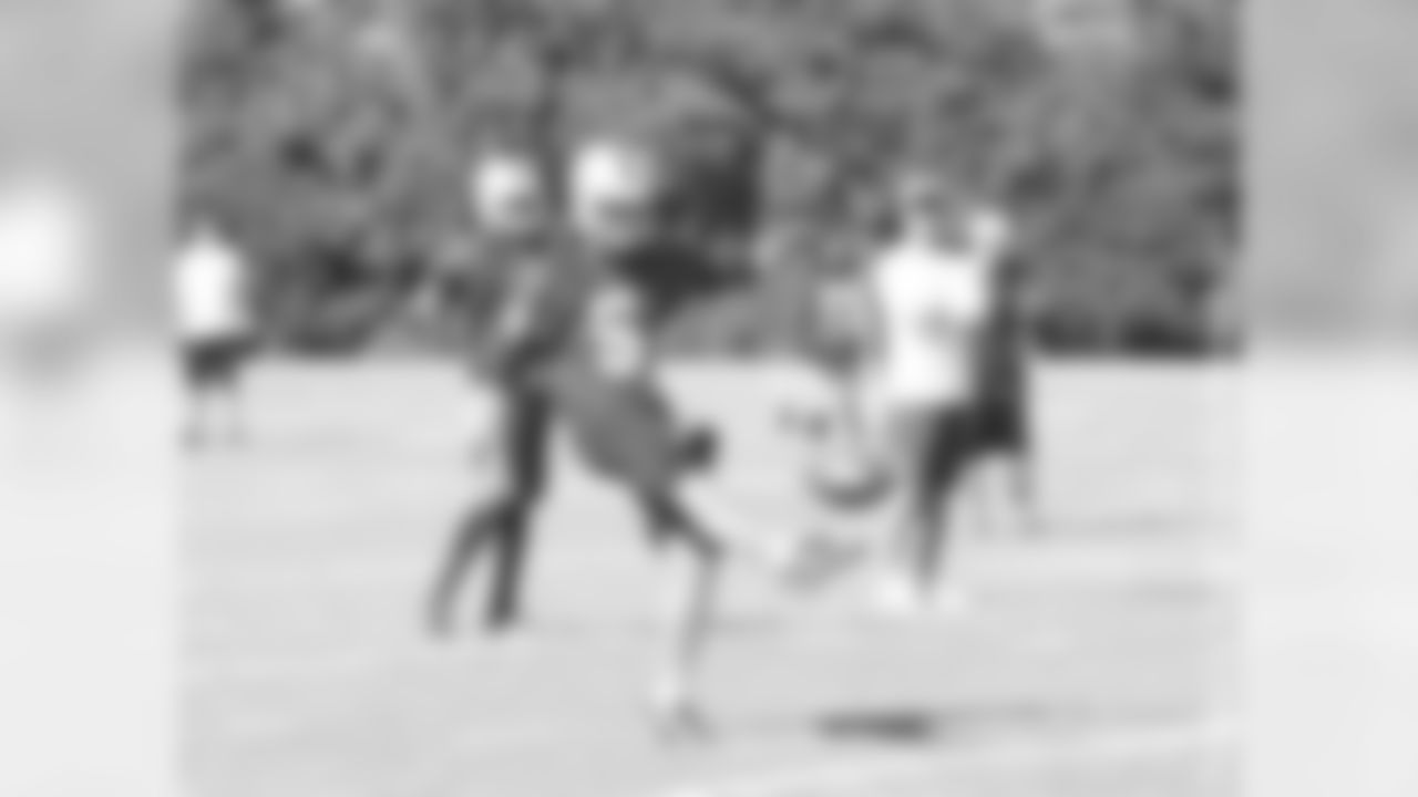 P Chris Kluwe kicks a football