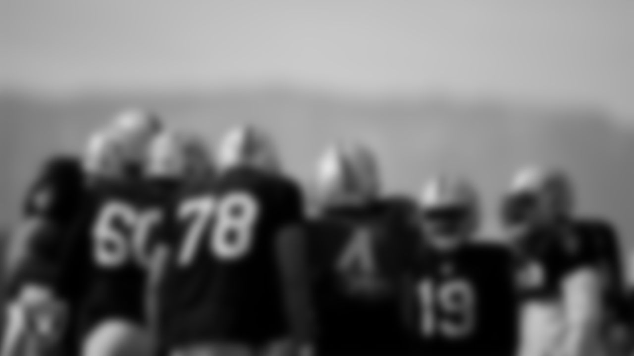 The Las Vegas Raiders offense huddles during practice at Intermountain Healthcare Performance Center.