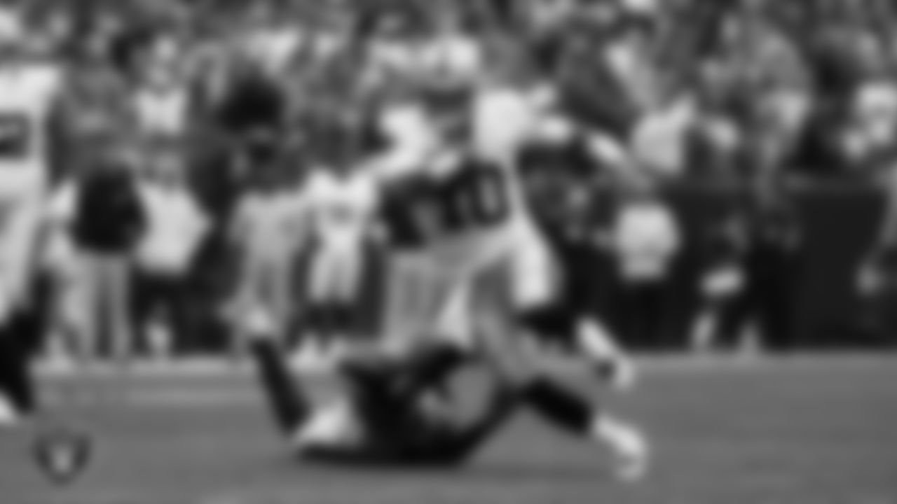 Las Vegas Raiders quarterback Jimmy Garoppolo (10) rushes during the regular season away game against the Denver Broncos at Empower Field at Mile High.