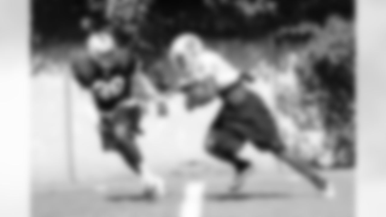 WR Denarius Moore is pursued by CB DeMarcus Van Dyke.