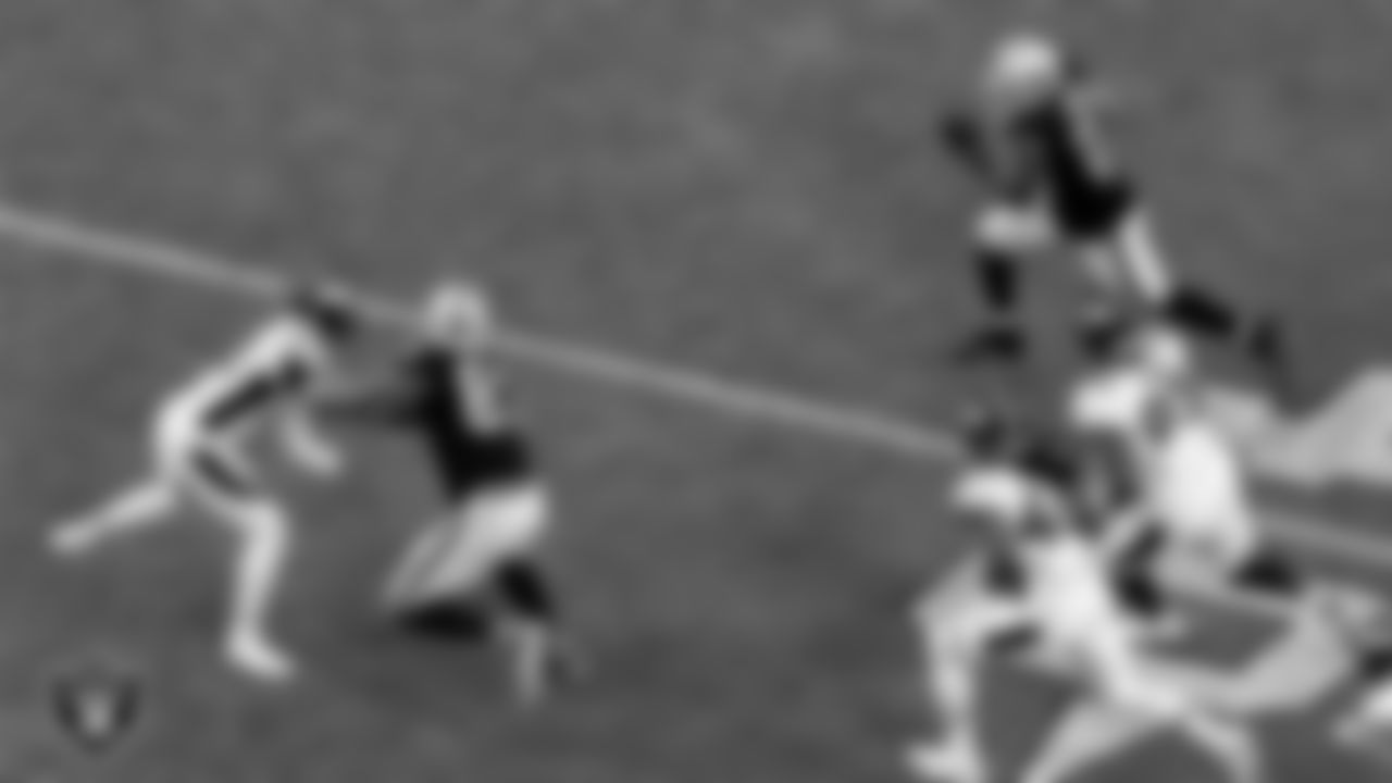 Las Vegas Raiders tight end Darren Waller (83) blocks for running back Devontae Booker (23) during the regular season home game against the Denver Broncos.