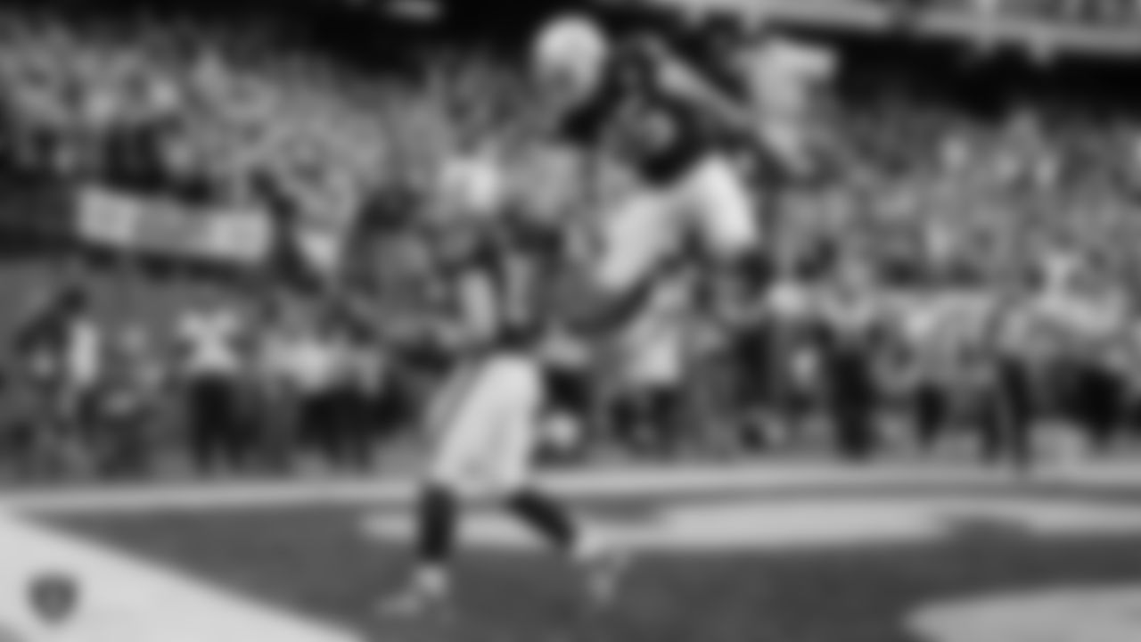 Raiders tight end Foster Moreau (87) is congratulated by fullback Alec Ingold (45) after a 1-yard touchdown catch during the regular season game against the Tennessee Titans.