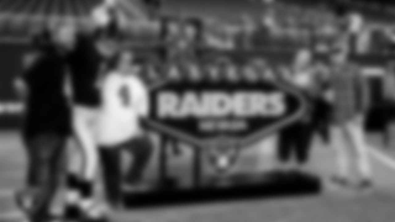 Raider Rusher poses for a photo with Season Ticket Holders during the appreciation event.