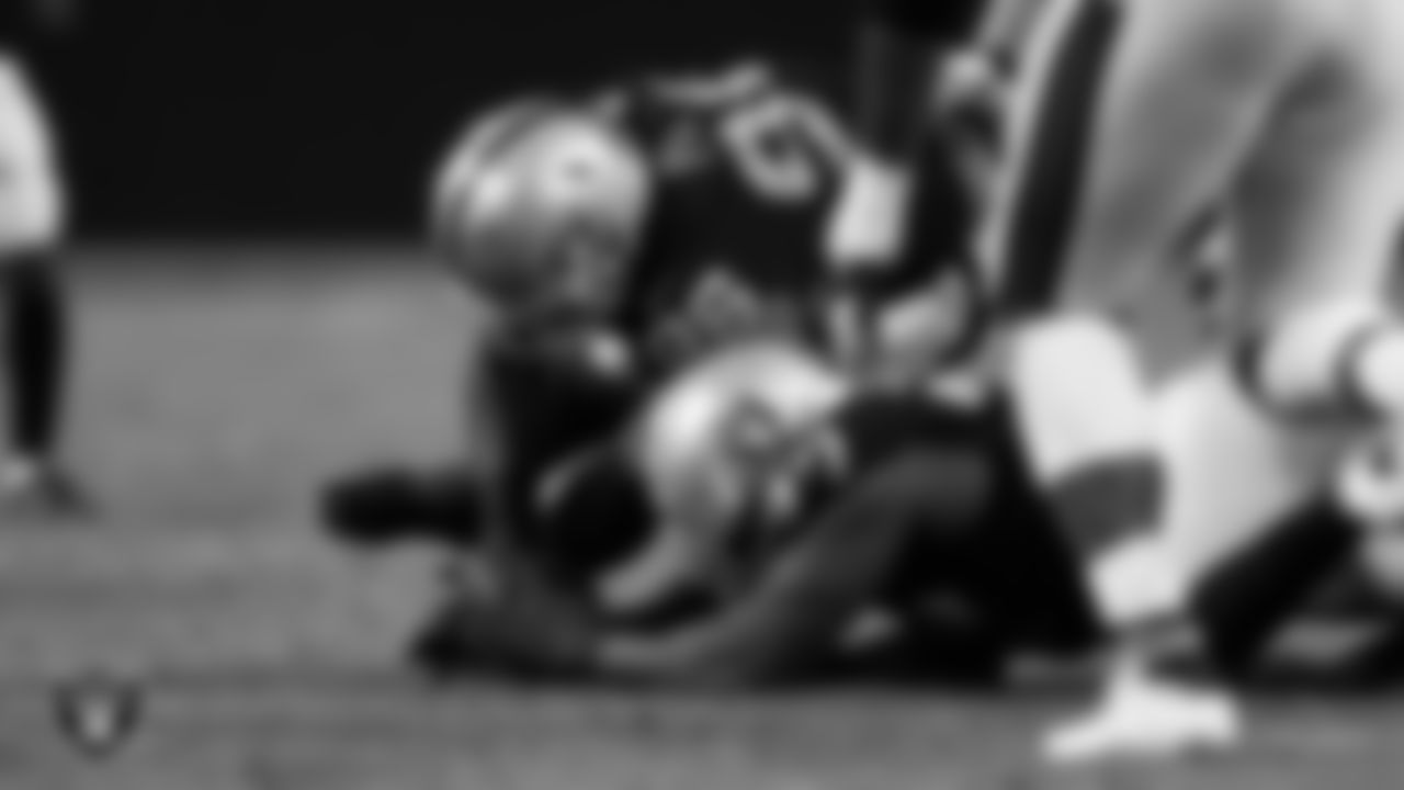 Las Vegas Raiders defensive tackle Darius Philon (96) recovers a fumble during the regular season home game against the Baltimore Ravens.