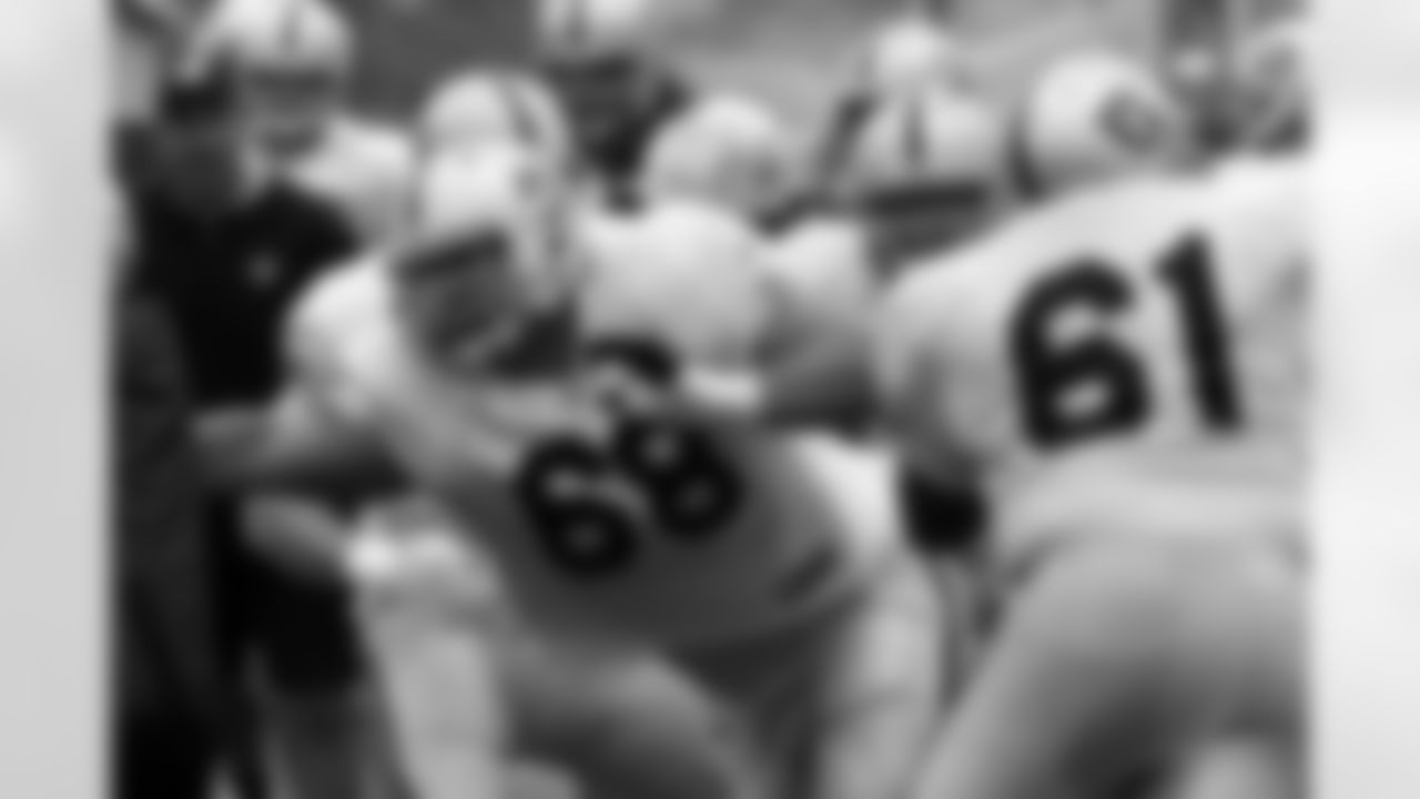 Raiders Offensive linemen fight to make their blocks. Photo By Tony Gonzales