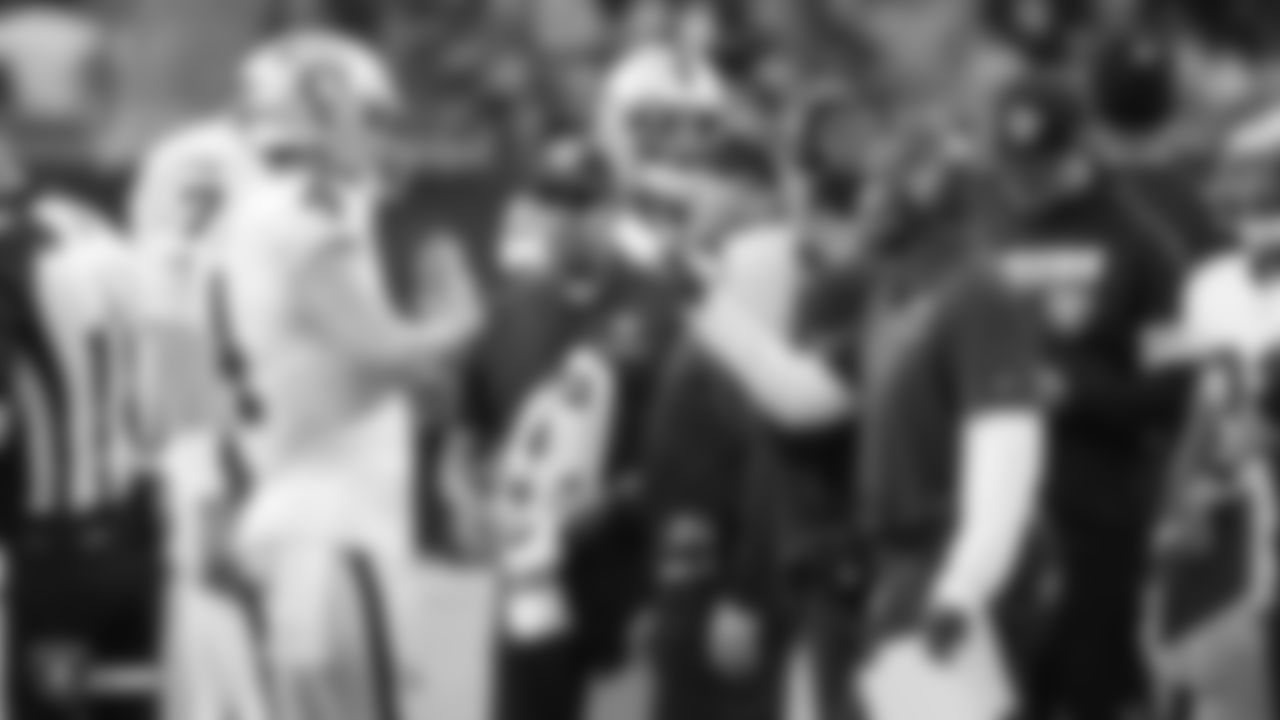 Raiders quarterback Derek Carr (4), Head Coach Jon Gruden and running backs coach Kirby Wilson during the regular season game against the Houston Texans at NRG Stadium.
