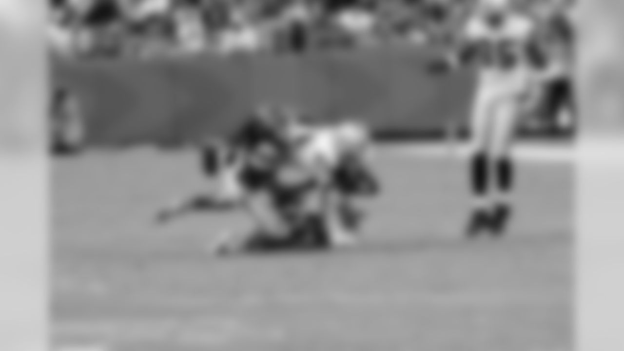 TE Brandon Myers dives forward to get a few extra yards as he's tackled.