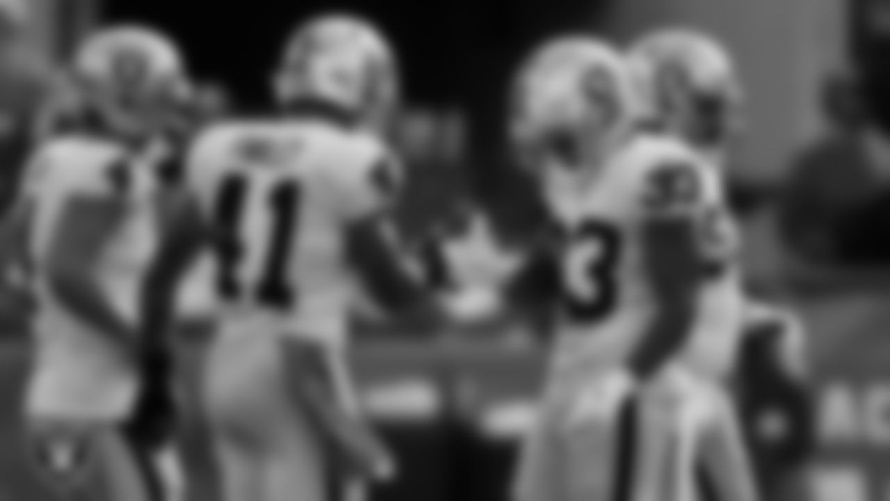 Las Vegas Raiders safety Matthias Farley (41) and safety Roderic Teamer (33) celebrate after a missed field goal during the regular season away game against the Jacksonville Jaguars at TIAA Bank Field.