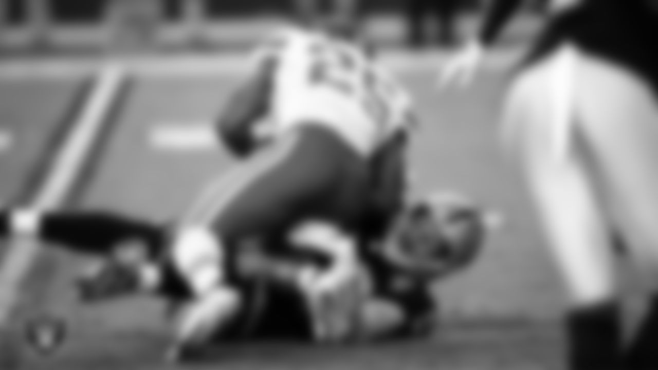 Las Vegas Raiders defensive end Maxx Crosby (98) makes a tackle during the regular season home game against the Kansas City Chiefs.