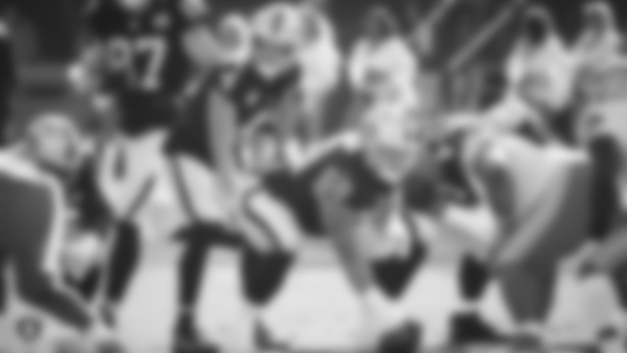 Raiders quarterback Derek Carr (4) and offensive lineman Andre James (68) line up before the snap during the regular season game against the Detroit Lions.