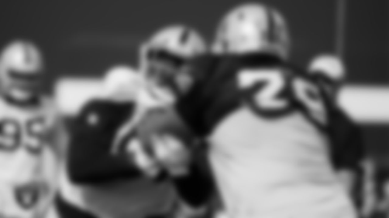 Las Vegas Raiders defensive tackle Damion Square (97) and offensive lineman Jeremiah Poutasi (79) during practice at Intermountain Healthcare Performance Center.