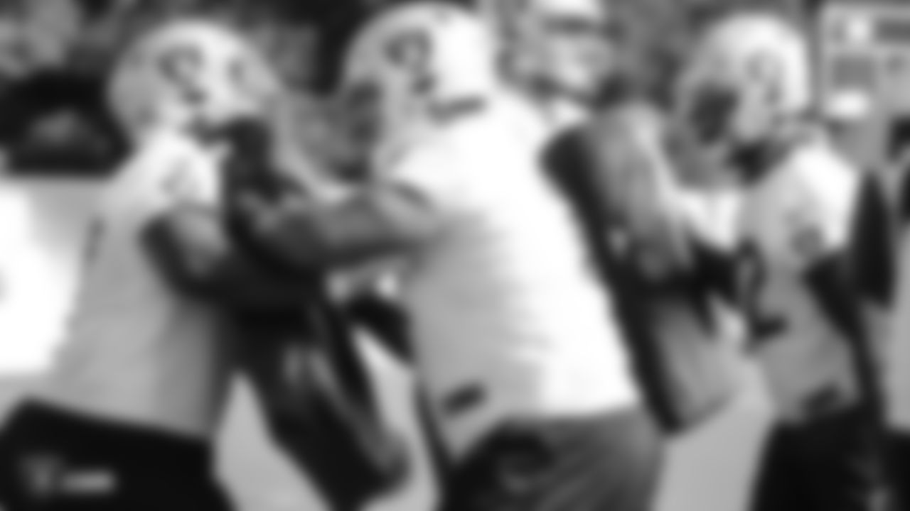 Raiders guard Lester Cotton Sr. (67) and tackle Denzelle Good (71) go through offensive drills during practice.