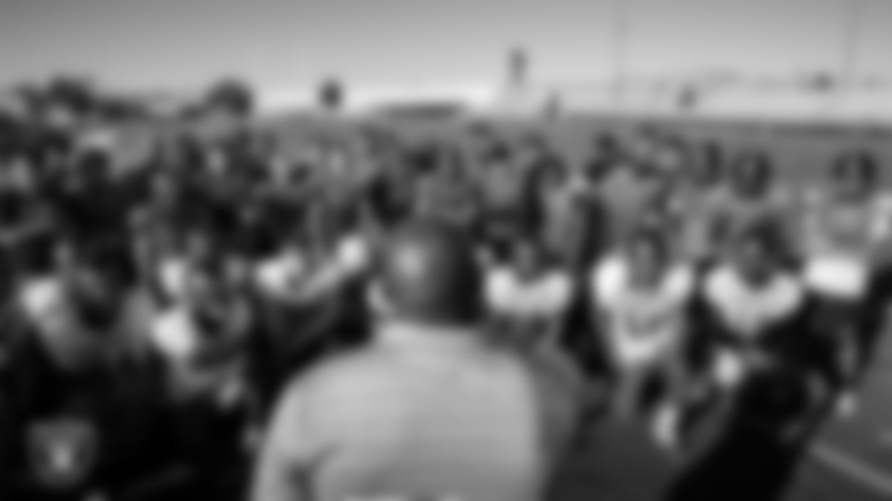 Las Vegas Raiders alumnus Roy Hart speaks to the Chaparral High School football team.
