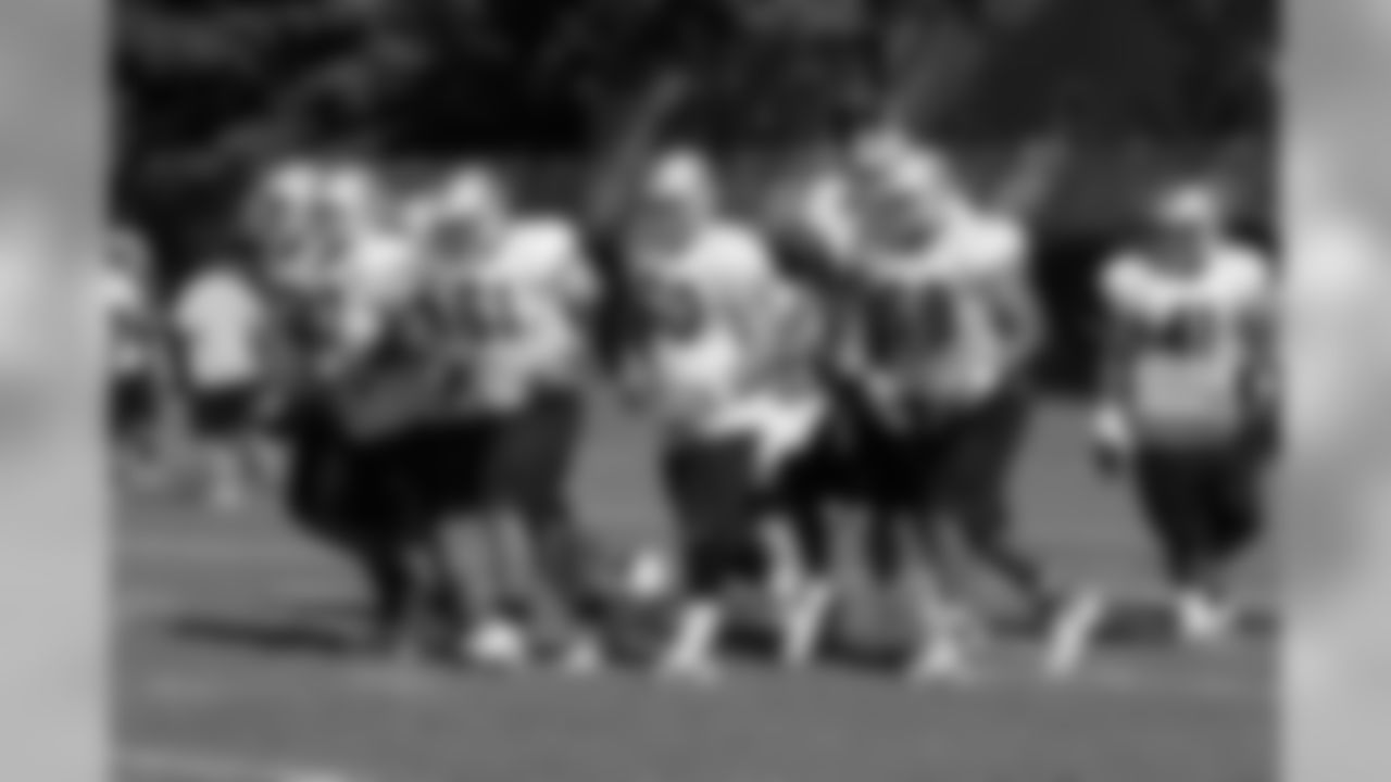 The offensive line breaks huddle.