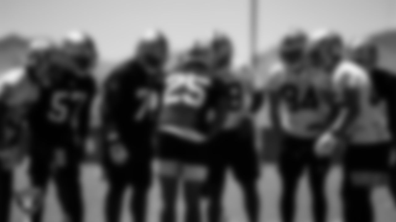 The Las Vegas Raiders huddle at an Organized Team Activity (OTA).