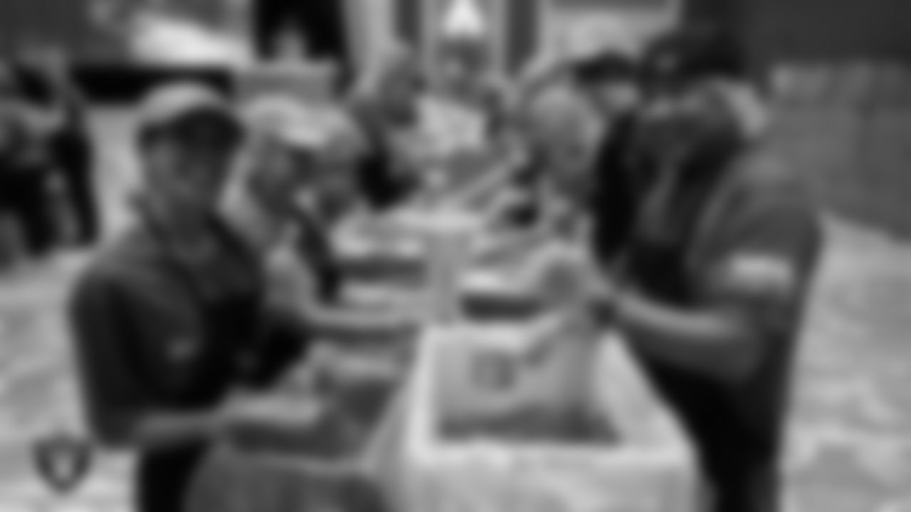 Volunteers pack meals during the Feed the Funnel Party at Wynn Resort.