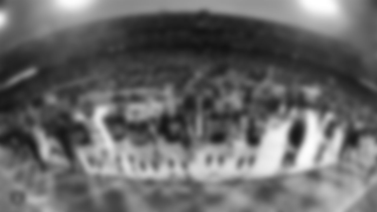Oakland Raiders players stand for the national anthem during The Oakland Raiders game against the Denver Broncos at Oakland-Alameda County Coliseum, Monday, December 24, 2018, in Oakland, California. Oakland won 27-14.