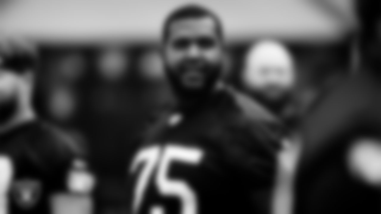 Las Vegas Raiders tackle Brandon Parker (75) on the field for a walkthrough.
