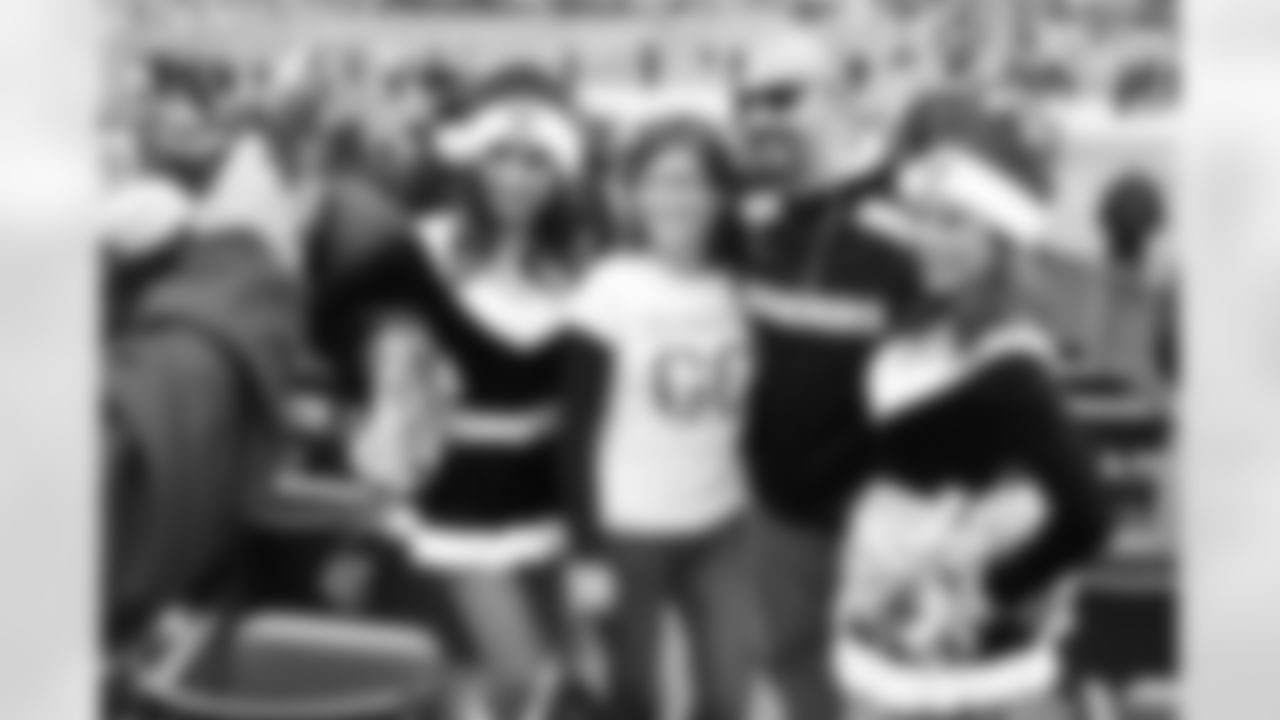 Raiderettes Rachel and Jennifer pose for photos with fans.