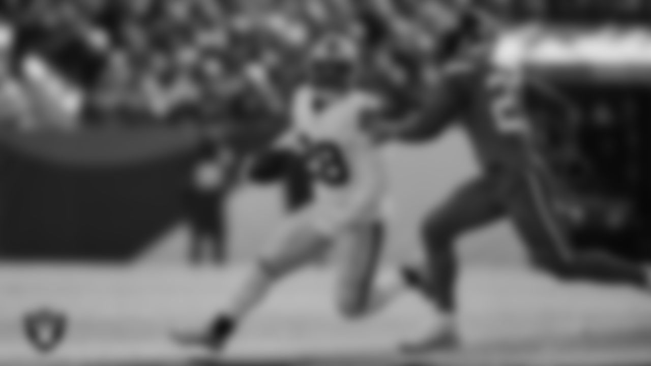 Las Vegas Raiders running back Josh Jacobs (28) rushes during the regular season away game against the Denver Broncos at Empower Field at Mile High.