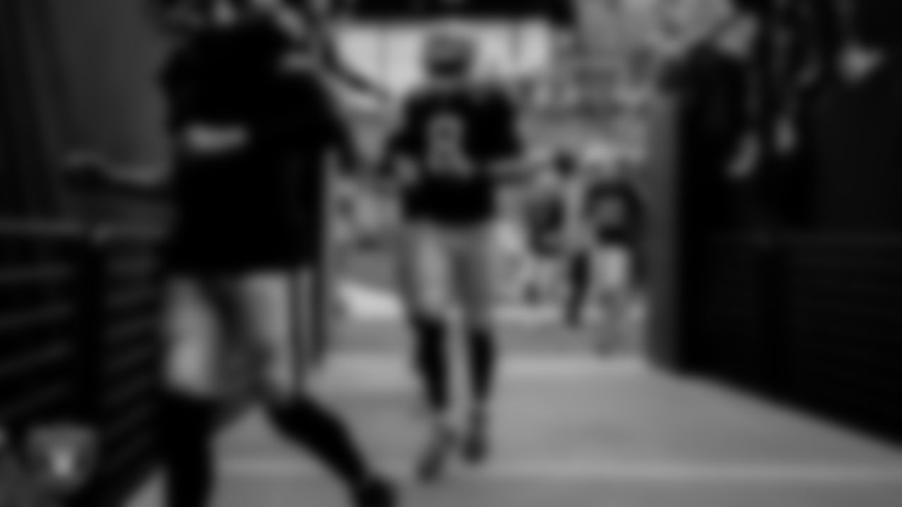 Las Vegas Raiders quarterback Marcus Mariota (8) heads back to the locker room after warming up on the field before the regular season home game against the Cincinnati Bengals.
