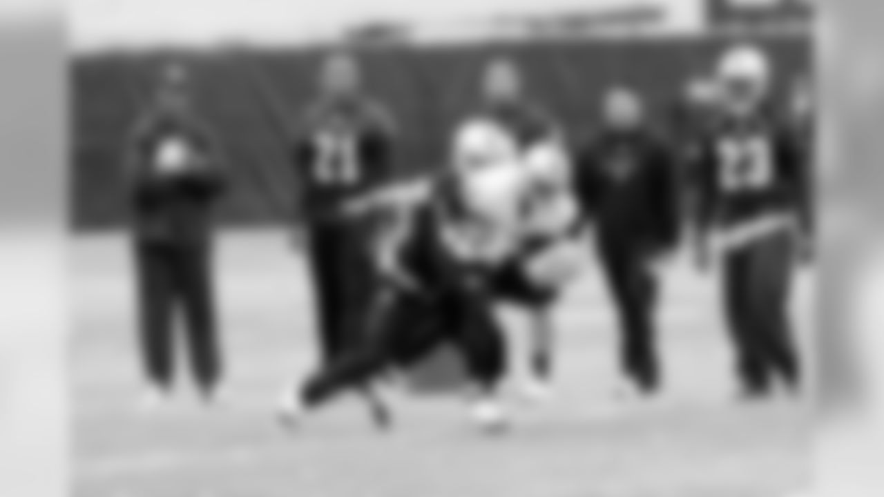 A receiver makes a catch despite tight coverage. Photo by Tony Gonzales.