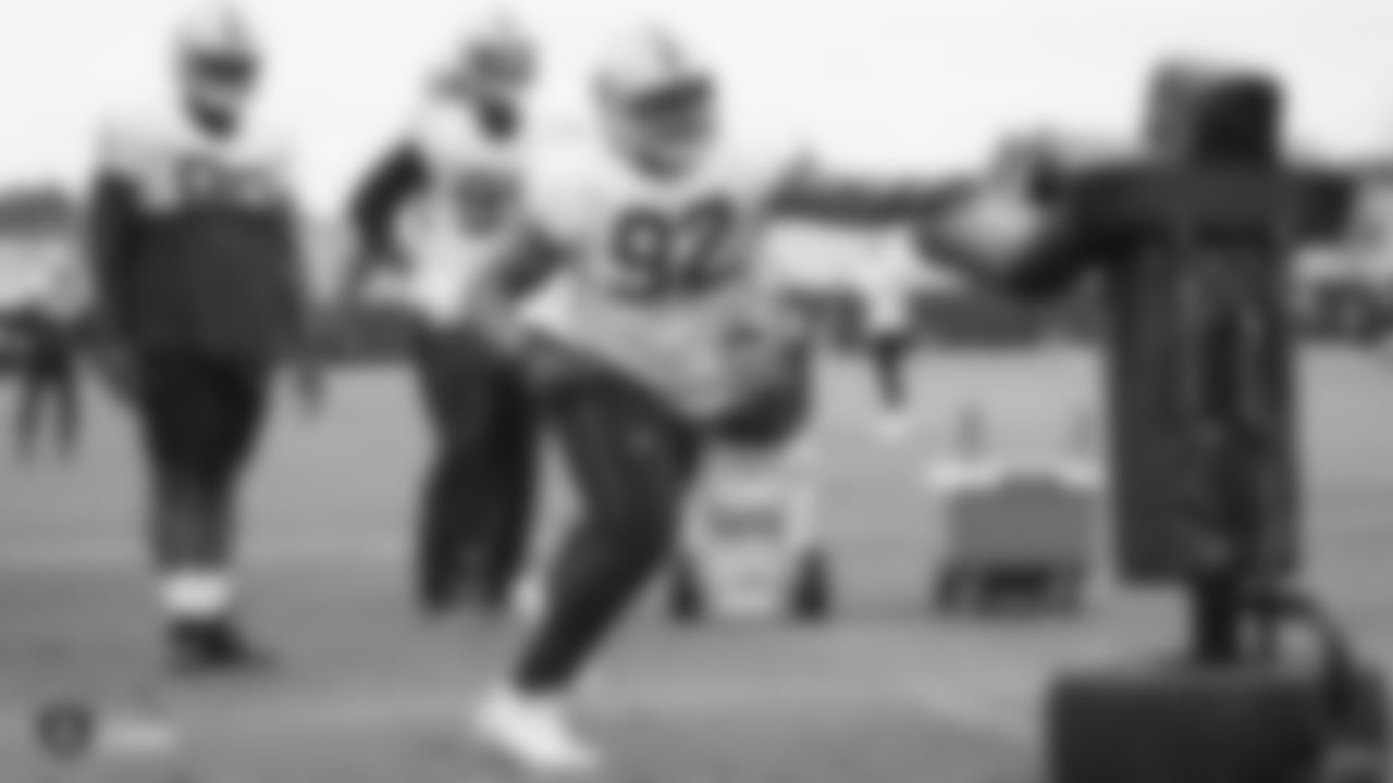 Raiders defensive tackle P.J. Hall (92) goes through defensive drills.