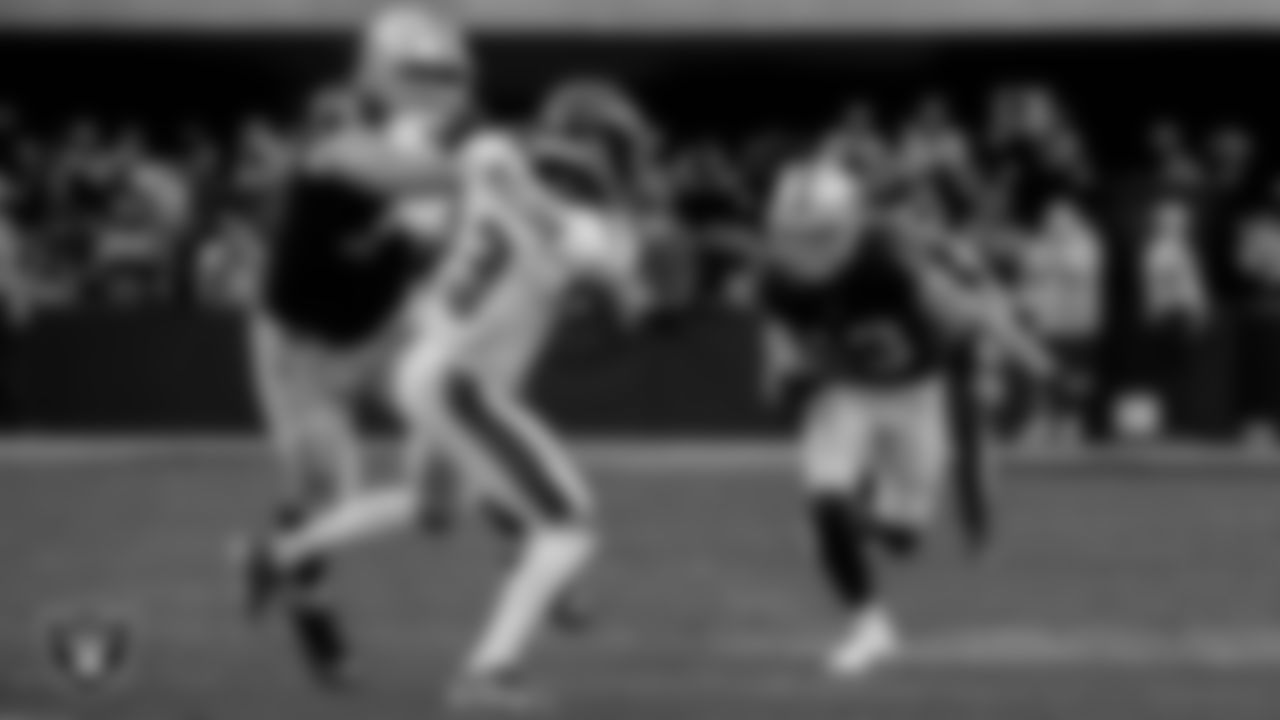 Las Vegas Raiders tackle Kolton Miller (74) blocks as wide receiver Hunter Renfrow (13) runs with the ball during the regular season home game against the Philadelphia Eagles.