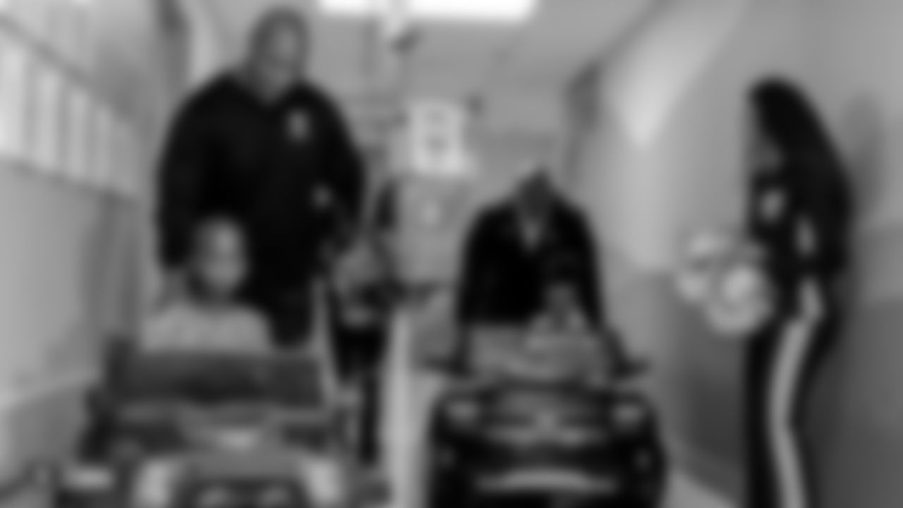 The Raiders, represented by alumni Chris McLemore and Roy Hart, and the Raiderettes, travel to University Medical Center of Southern Nevada to visit and interact with young patients and their families, sign autographs, and take photos, Tuesday, November 13, 2018, in Las Vegas, Nevada.