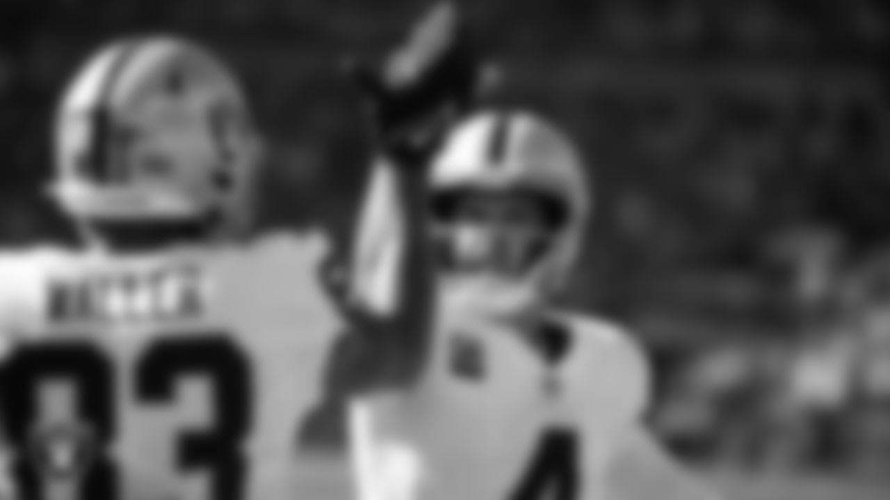 Las Vegas Raiders quarterback Derek Carr (4) celebrates with tight end Darren Waller (83) after making a 61-yard touchdown pass during the regular season away game against the Pittsburgh Steelers.
