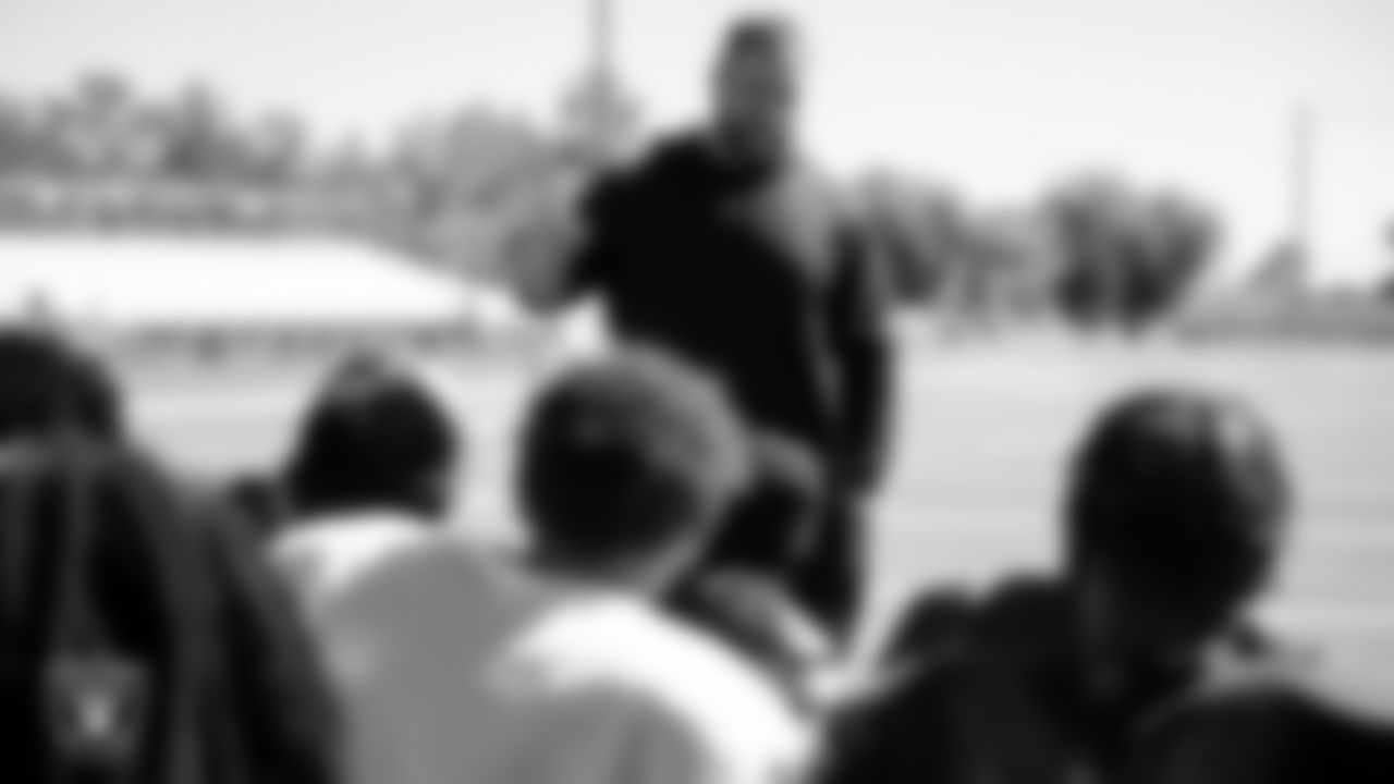 Las Vegas Raiders offensive lineman Jordan Meredith (61) speaks to the Cheyanne High School football team before their practice at Cheyanne High School.