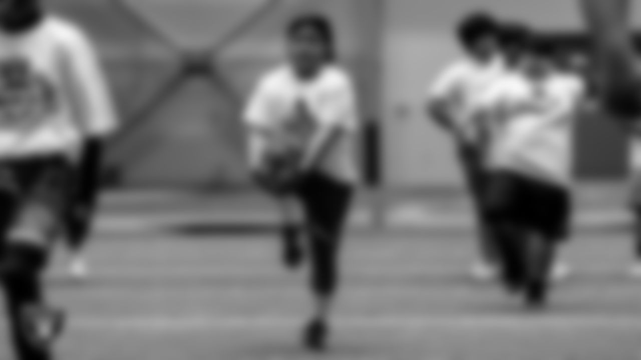 An athlete warms up before drills during the ELITE Academy at the Las Vegas Raiders Headquarters.