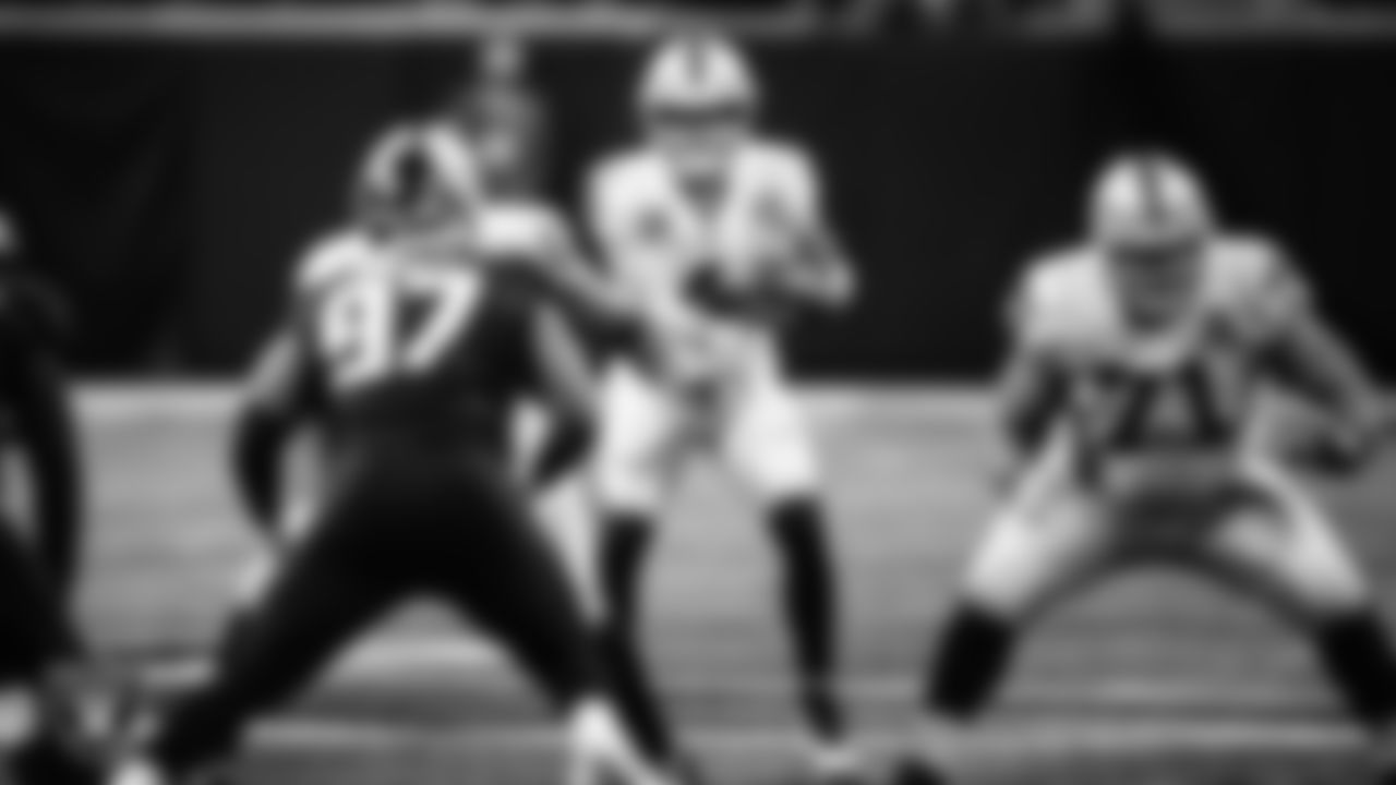 Las Vegas Raiders quarterback Derek Carr (4) receives the snap during the regular season away game against the Atlanta Falcons.