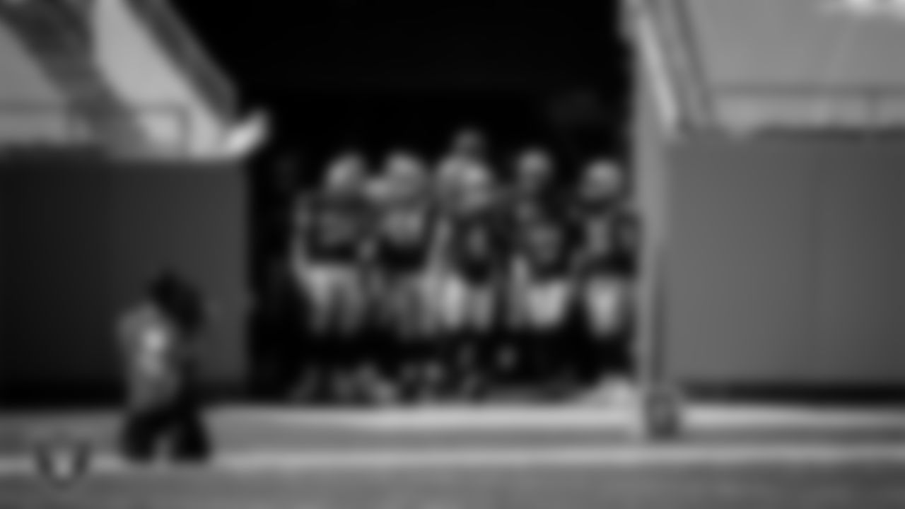 The Las Vegas Raiders are introduced onto the field before their regular season away game against the Carolina Panthers.