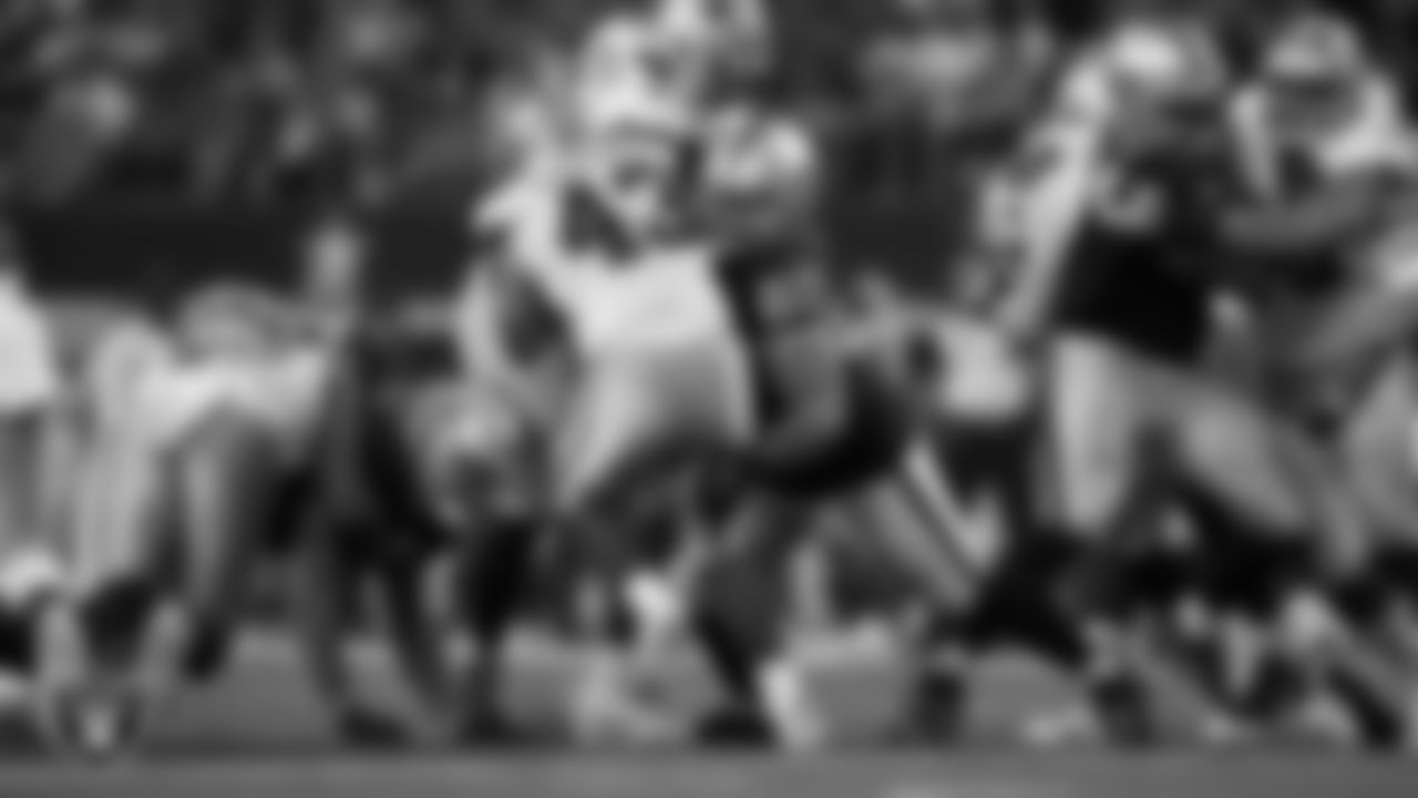 Las Vegas Raiders defensive tackle Doug Costin (60) makes a tackle during the preseason away game against the Dallas Cowboys at AT&T Stadium.