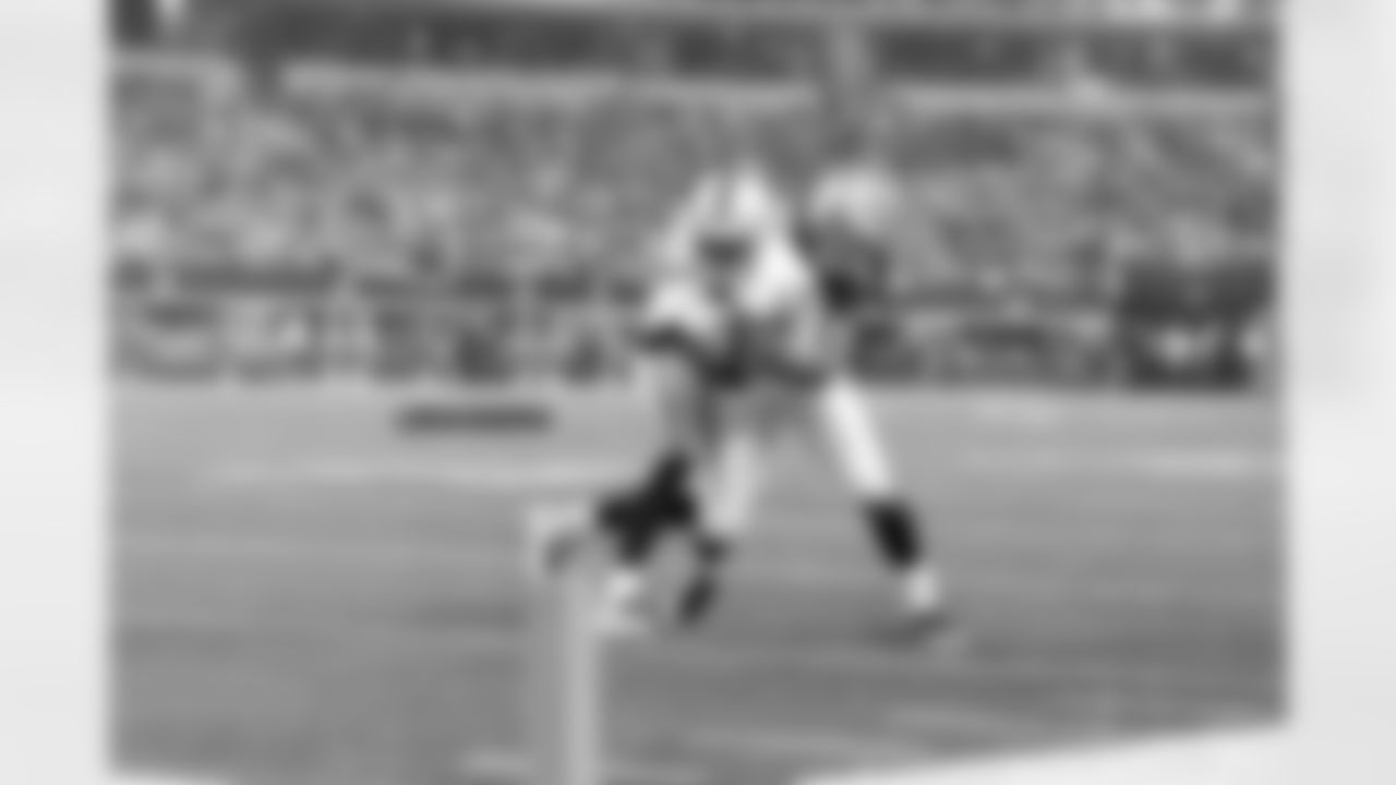 WR Jacoby Ford fights for the extra yard.